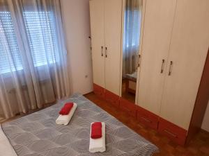 Postel nebo postele na pokoji v ubytování Apartman RIGEL