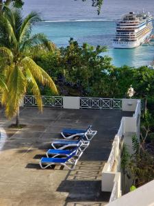 a view of the ocean from the balcony of a cruise ship at Panoramic View@Sky Castles, Columbus Heights in Ocho Rios