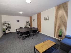 a dining room with a table and chairs at Wellness Apartmány Fatrapark 1 Malinô Brdo in Ružomberok