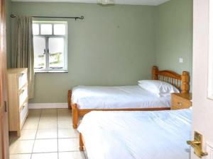 Ein Bett oder Betten in einem Zimmer der Unterkunft Church Cottage