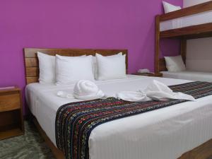 Postel nebo postele na pokoji v ubytování Itza Hotel Akumal
