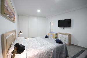 Postel nebo postele na pokoji v ubytování Apartment El Medano Sunset II