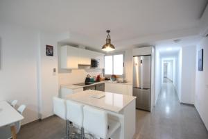 Kuchyň nebo kuchyňský kout v ubytování Apartment El Medano Sunset II