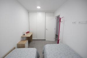 Postel nebo postele na pokoji v ubytování Apartment El Medano Sunset II