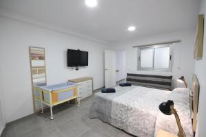 Postel nebo postele na pokoji v ubytování Apartment El Medano Sunset II