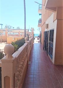 a balcony of a building with the ocean in the background at FUENGIROLA PLAYA y PISCINA PERLA 2 ESTUDIO in Fuengirola