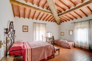 a bedroom with a bed and a couch in a room at Agriturismo Albergotti in Arezzo +45 photos