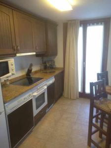 Kuchyň nebo kuchyňský kout v ubytování Apartamento Saliecho 3