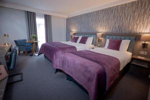 Tempat tidur dalam kamar di Kilkenny Ormonde Hotel