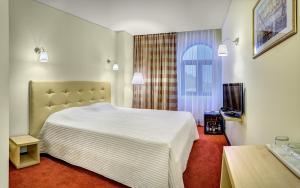 Postel nebo postele na pokoji v ubytování Capitol Hotel + 37 fotografií