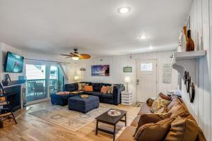 a living room with a couch and a fireplace at Pelican Pointe 2C in Clearwater Beach