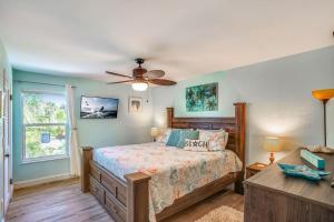 a bedroom with a bed and a window at Pelican Pointe 2C in Clearwater Beach