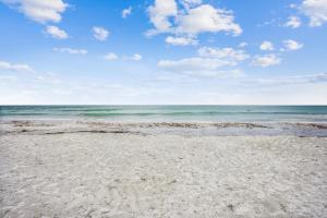 a sandy beach with the ocean in the background at Pelican Pointe 2C in Clearwater Beach
