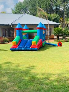 a inflatable playground in the yard of a house at Khanyisa Lifestyle in Vereeniging