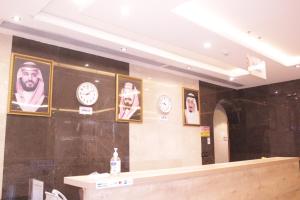 a store with clocks on the wall and a counter at التميز الراقي - السليمانية in Jeddah
