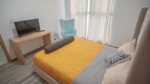 Postel nebo postele na pokoji v ubytování Shanarani Apartament