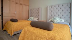 Postel nebo postele na pokoji v ubytování Shanarani Apartament