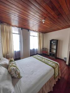 Cama o camas de una habitación en Hotel Casa Tago