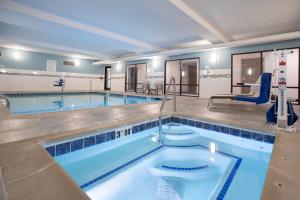 a large swimming pool with a lap pool at Holiday Inn Express Hotel & Suites Grand Junction by IHG in Grand Junction