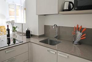 a kitchen with a sink and a counter top at Romantic Verona in Verona