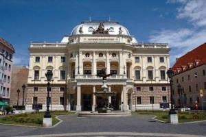 a large white building with a dome on top of it at Ubytovanie DOBRÁ LIPA in Bratislava