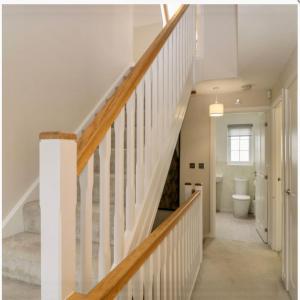 a staircase in a house with a toilet in a bathroom at Holly House - Executive Rural Home with Jacuzzi in Penistone