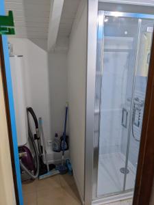 a glass shower in a bathroom with at Résidence Vologne in La Bresse +19 photos