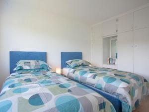 two beds sitting next to each other in a bedroom at Bethany in Brixham