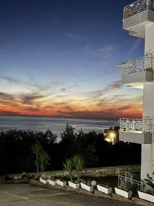 a view of the ocean from a building at sunset at Villa 61 Sea and Sunset View in Dhërmi