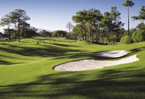 a view of a golf course with a green at Troia Residence by The Editory - Apartamentos Marina in Troia