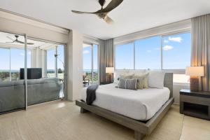 Postel nebo postele na pokoji v ubytování O Condominium Beachfront Residences, by Bocobay Aruba