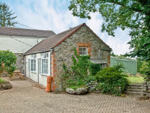 a small stone house with a brick yard at Granary - Uk31175 in Saint Martin