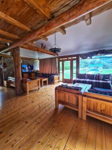 a large living room with a pool table at Villa California in Rezine