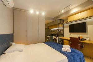 Ένα ή περισσότερα κρεβάτια σε δωμάτιο στο Studios Próximo a Av Paulista com Piscina no Rooftop e Sauna +90 φωτογραφίες