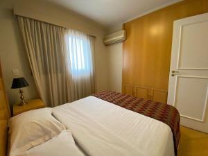 Postel nebo postele na pokoji v ubytování Flat Residence Moema c/ cozinha e lavadora UH104
