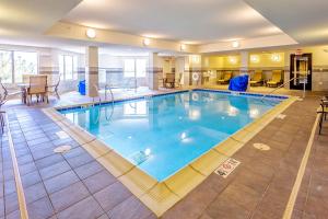 a large swimming pool in a hotel room at Holiday Inn Express Hotel & Suites Billings by IHG in Billings