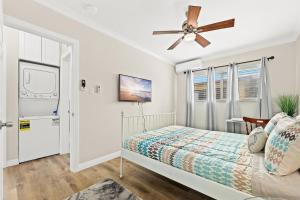 a bedroom with a bed and a ceiling fan at Bright & Cozy Getaway-10min to Downtown LA in Alhambra