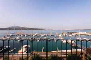 a bunch of boats docked in a harbor at Troia Residence by The Editory - Apartamentos Marina in Troia