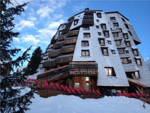 a tall building on top of a snow covered slope at Hôtel des Dromonts by SOWELL COLLECTION in Avoriaz