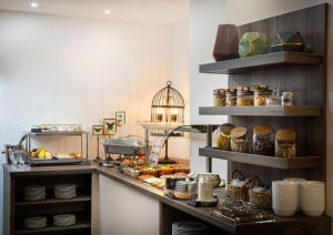 a kitchen filled with pots and pans and dishes at Arthotel ANA Amadeus in Vienna