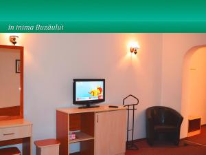 En tv och/eller ett underhållningssystem på Pensiunea Casa Matei