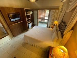 Cama ou camas em um quarto em Hiu Hotel