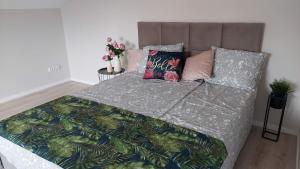 Ein Bett oder Betten in einem Zimmer der Unterkunft APARTAMENTY MONTANIA WISŁA