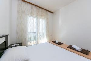 Posteľ alebo postele v izbe v ubytovaní Apartment Gradac 14708b