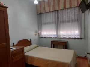 Posteľ alebo postele v izbe v ubytovaní Hotel Chipén