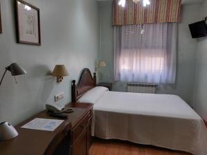Posteľ alebo postele v izbe v ubytovaní Hotel Chipén