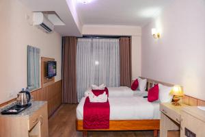 Letto o letti in una camera di Drishya Hotel