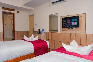 Letto o letti in una camera di Drishya Hotel