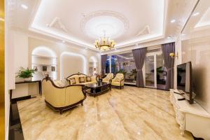 TV a/nebo společenská místnost v ubytování Wisteria Hotel