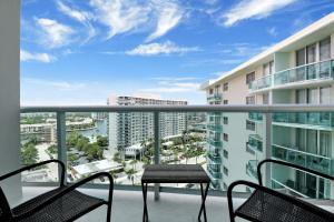 a balcony with chairs and a table on a building at THE TIDES 1bedroom apt 15th floor WE ARE ON THE BEACH! in Hollywood